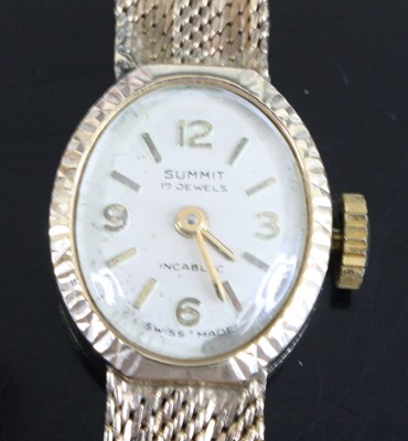 Lot 291 - A Summit lady's 9ct gold bracelet watch having...