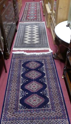 Lot 1140 - An Afghan Kazak woollen red ground hall runner,...