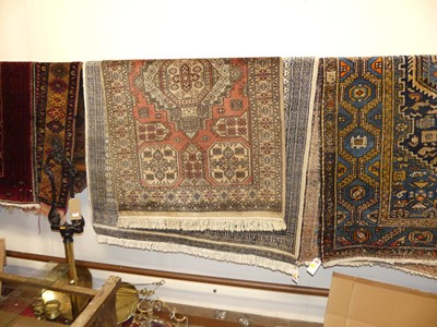 Lot 1149 - A Persian woollen pale ground Bokhara rug;...