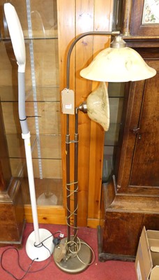 Lot 1168 - A contemporary brushed brass twin floor light;...