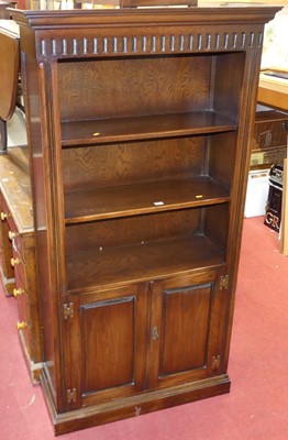 Lot 1173 - A contemporary joined oak freestanding open...