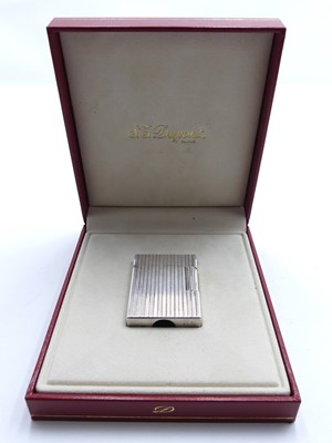 Lot 408 - An SJ Dupont cigarette lighter of rectangular...