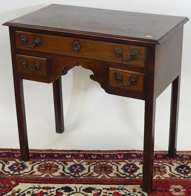 Lot 1191 - A George III mahogany three-drawer low boy,...