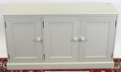 Lot 1202 - A modern pale grey painted pine low three-door...