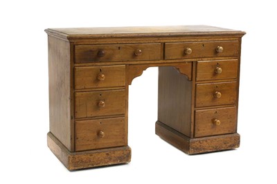 Lot 1204 - A mid-Victorian mahogany kneehole writing desk,...