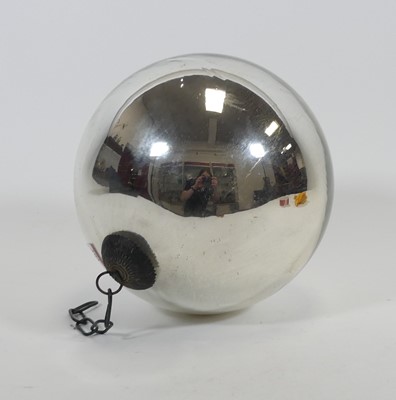 Lot 104 - A silvered glass witch's ball, approx dia. 25cm