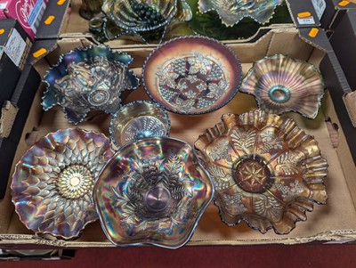 Lot 528 - A collection of carnival glass, mainly darker...