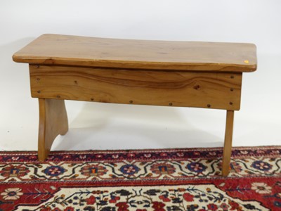 Lot 1225 - A contemporary elm hinge top twin stool, width...