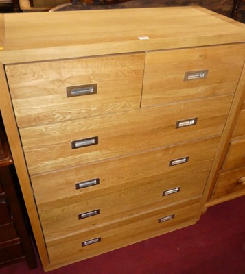 Lot 1235 - A contemporary blond oak square front chest of...