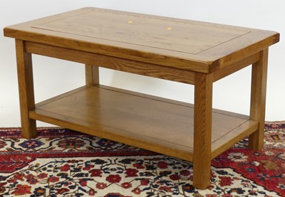 Lot 1257 - A contemporary joined oak two-tier coffee...