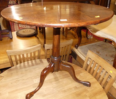 Lot 1270 - An early 19th century oak circular tilt-top...