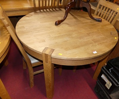 Lot 1271 - A contemporary blond oak dining suite,...