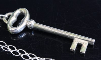 Lot 308 - A silver key pendant, on neck chain, stamped...