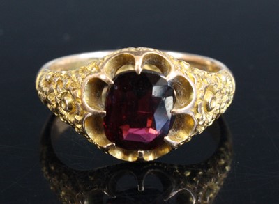 Lot 310 - An Edwardian 9ct gold and garnet set dress...