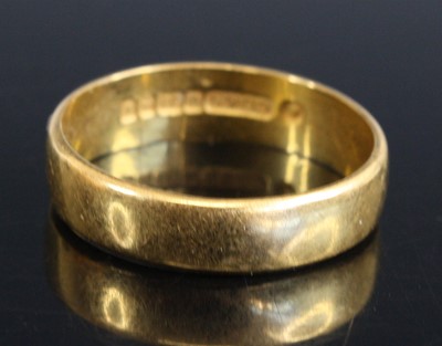 Lot 319 - A modern 22ct gold wedding band, sponsor CJ&S,...