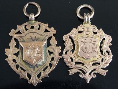 Lot 337 - Two Edwardian 9ct gold sporting medallions,...