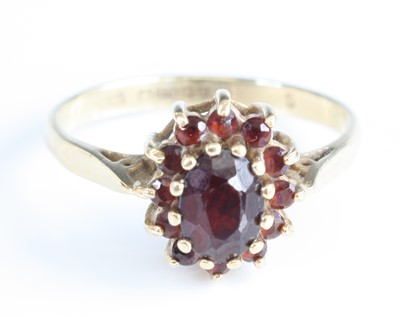 Lot 350 - A 9ct gold garnet flowerhead cluster ring,...