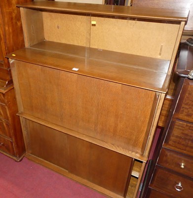 Lot 1304 - A 1960s oak student's bureau, having twin...