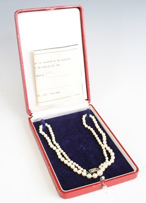 Lot 354 - A Mikimoto cultured and knotted pearl single...