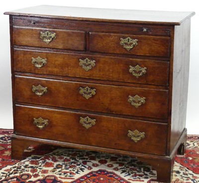 Lot 1321 - An early 19th century provincial oak chest of...