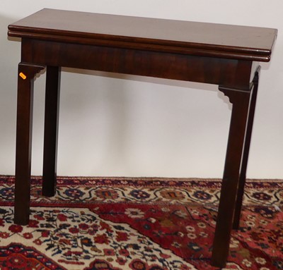 Lot 1324 - A George III mahogany fold-over tea table,...