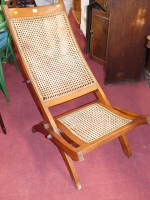 Lot 1206 - A hardwood and cane inset folding deck chair