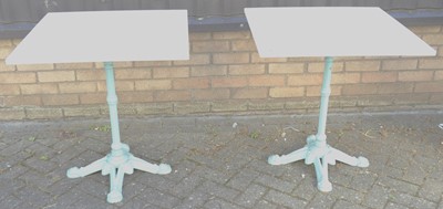 Lot 1337 - A pair of turquoise painted cast iron based...