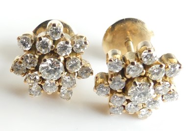 Lot 2291 - A pair of 14ct gold diamond snowflake style...