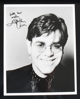 Lot 729 - Elton John, a 25 x 20cm black and white...