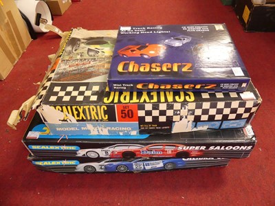 Lot 1527 - A collection of slot car racing sets to...