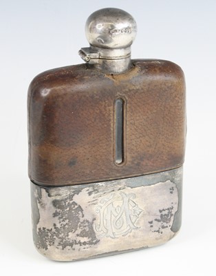 Lot 800 - A late Victorian hip flask, having a leather...