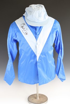 Lot 779 - Horse racing silks, a jockey's jacket and cap...