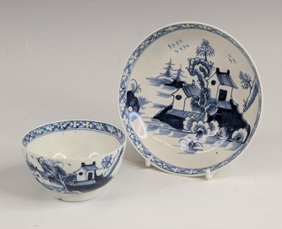 Lot 2045 - A Lowestoft porcelain tea bowl and saucer,...