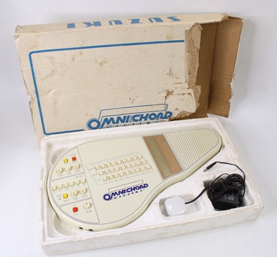 Lot 665 - A Suzuki OM-27 Omnichord, in off-white plastic,...