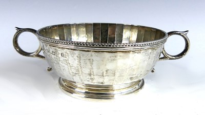 Lot 136 - A late Art Deco silver small twin handled bowl,...