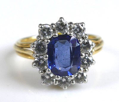 Lot 2319 - A yellow and white metal, sapphire and diamond...