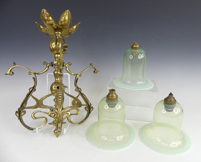 Lot 165 - A decorative Art Nouveau polished brass...