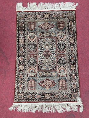 Lot 2592 - A Persian silk Herix prayer rug, having boxed...