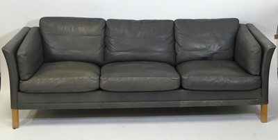 Lot 398 - A 1970s Danish grey leather three-seater sofa...