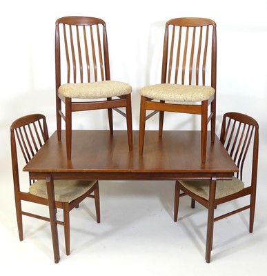 Lot 396 - A 1960s teak extending dining table, having a...