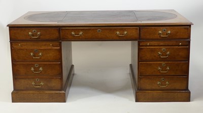 Lot 2613 - An oak and burr oak twin pedestal desk, having...