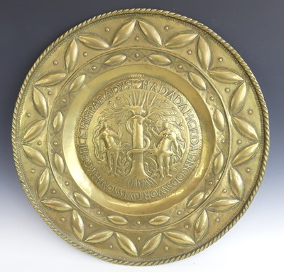 Lot 2401 - A brass Nuremberg alms dish, the central boss...