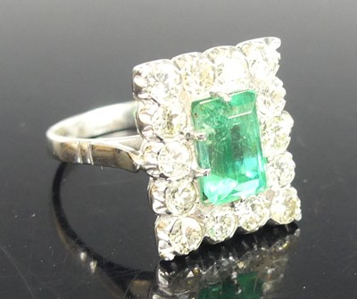 Lot 2279 - An Art Deco 18ct white gold Columbian emerald...