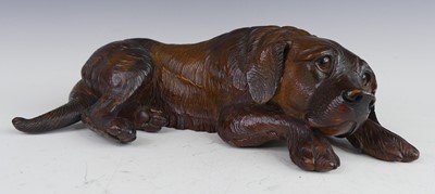 Lot 2406 - A circa 1900 Black Forest carved linden wood...