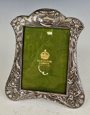 Lot 118 - An Art Nouveau silver embossed framed easel...