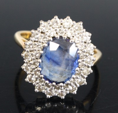 Lot 2318 - An 18ct yellow and white gold, sapphire and...