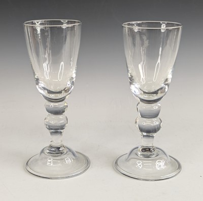 Lot 2076 - A pair of large glass wine goblets, the round...