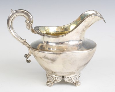 Lot 2145 - A William IV silver cream jug, of helmet form,...