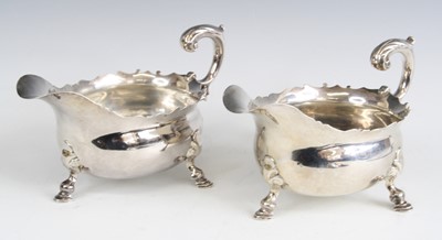 Lot 2096 - A pair of George II silver sauceboats, each...