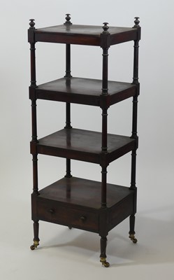 Lot 2566 - A late Regency rosewood four-tier whatnot, on...